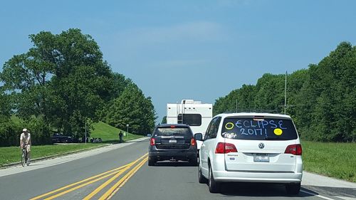 Cars on road against sky