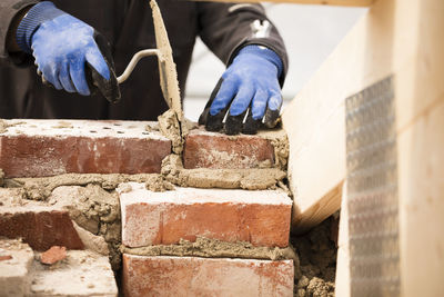 Bricklayer working on construction site