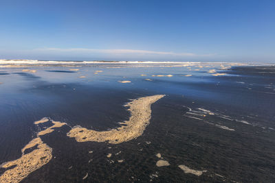 High angle view of beach against blue sky