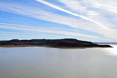 Scenic view of landscape against blue sky