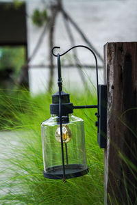 Close-up of electric lamp on field