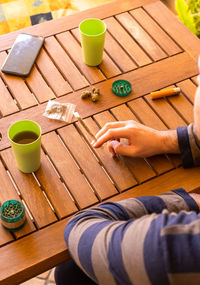 Low section of woman sitting on table