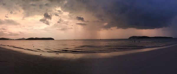 Scenic view of beach against sky during sunset