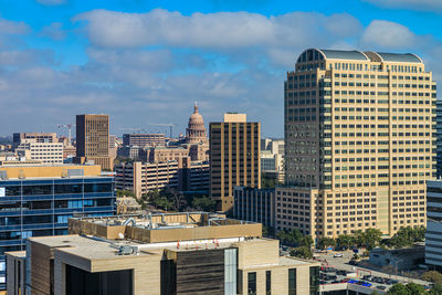 Buildings in city against sky