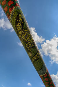 Low angle view of giraffe against blue sky