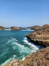 Scenic view of sea against clear blue sky