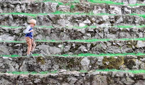 Person standing by wall