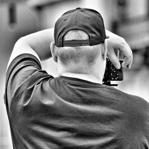 Close-up of man holding mobile phone
