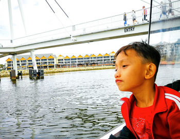 Portrait of boy looking away in water