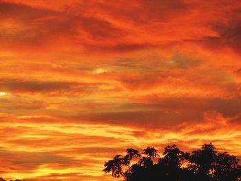 Low angle view of cloudy sky at sunset