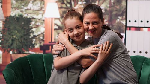 Portrait of young woman using mobile phone