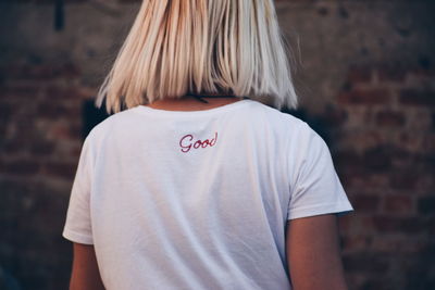 Rear view of woman standing outdoors