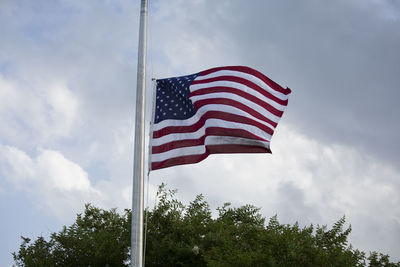 Low angle view of flag against sky