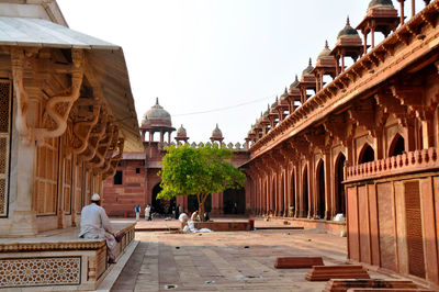 People at jama masjid against sky