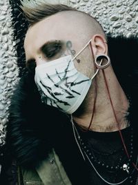 Close-up portrait of woman wearing mask