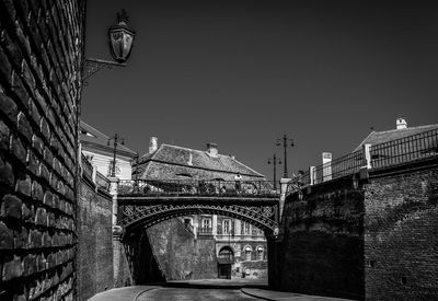 Low angle view of bridge against sky in city