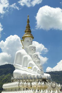 Low angle view of sculpture against building