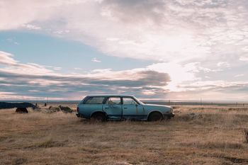 VIEW OF CAR ON FIELD