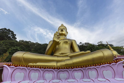 Low angle view of statue against sky