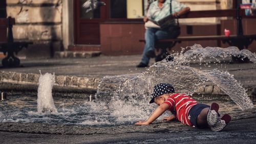 Rear view of woman in water