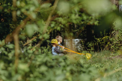 Little boys with butterfly nets in countryside. image with selective focus