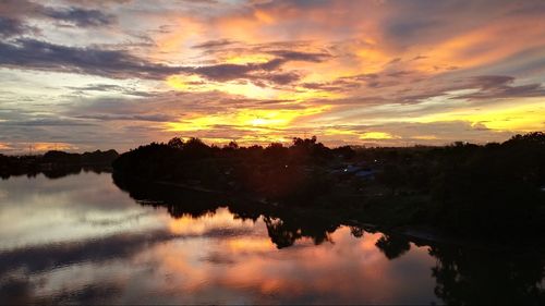 Scenic view of lake against sky during sunset