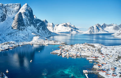 Lovely fishing village surrounded by mountains in the lofoten islands, norway. aerial view. 