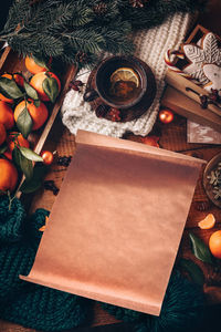 High angle view of christmas tree on table, sheet of parchment, copy space