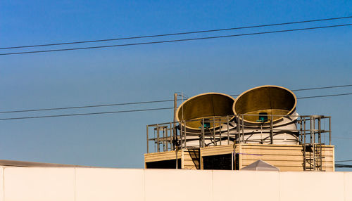 Low angle view of water tower against clear sky