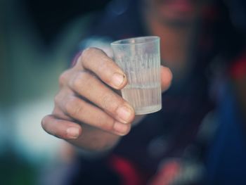 Close-up of hand holding drink