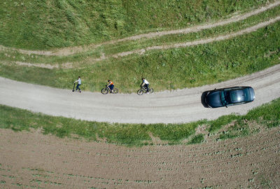 High angle view of vehicles on field