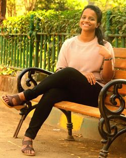 Portrait of smiling woman sitting on chair