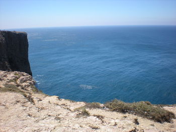 Scenic view of sea against clear blue sky