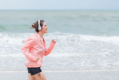 Woman standing at beach