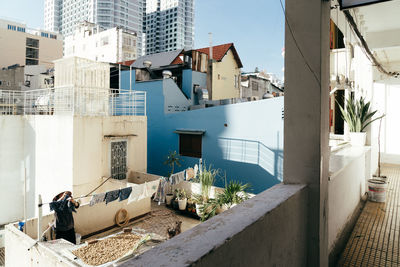 Houses against buildings in city