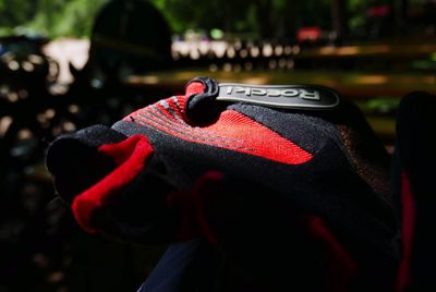 Close-up of person holding red umbrella