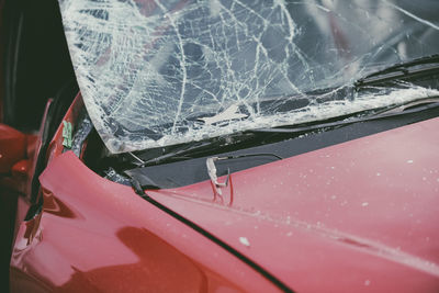 Close-up of broken red car