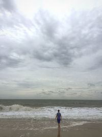 Scenic view of sea against cloudy sky