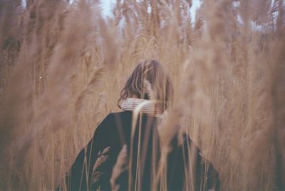 Portrait of woman standing in forest