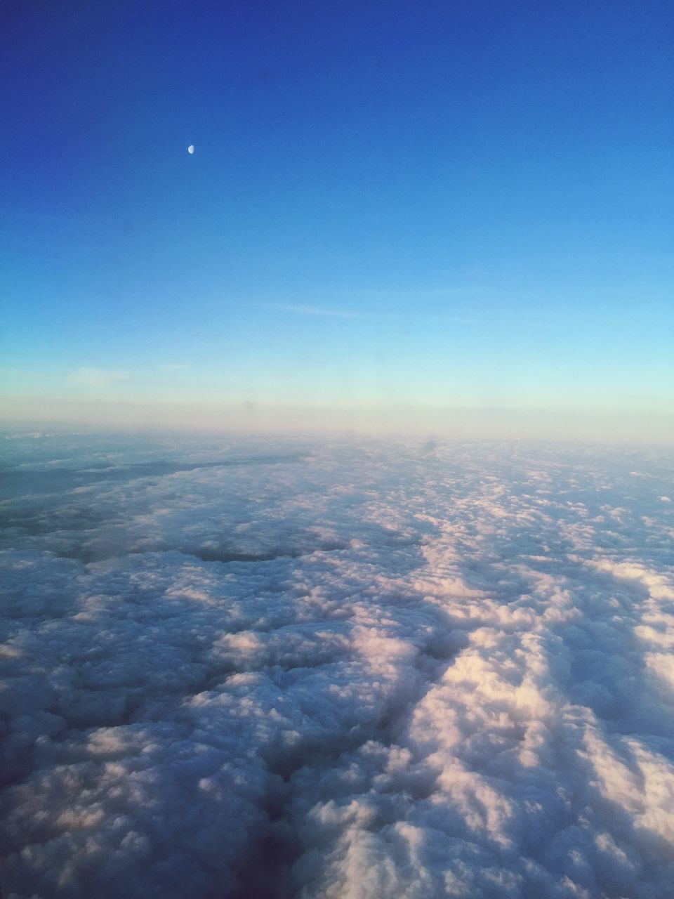 aerial view, blue, airplane, scenics, beauty in nature, sky, tranquil scene, nature, flying, tranquility, cloudscape, air vehicle, landscape, copy space, aircraft wing, transportation, idyllic, cloud - sky, sky only, cloud