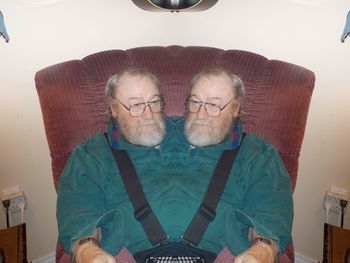 Portrait of a smiling young man sitting at home