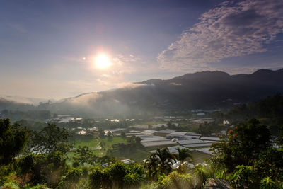 Scenic view of landscape against sky at sunset