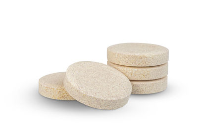 Close-up of stack of stones against white background