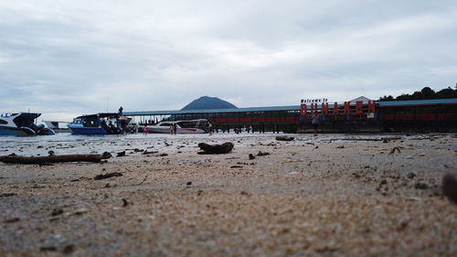 People on beach against sky