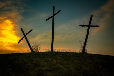 Silhouette tree on field against sky during sunset