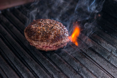 Close-up of meat on barbecue grill