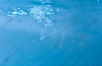 Close-up of water splashing in swimming pool