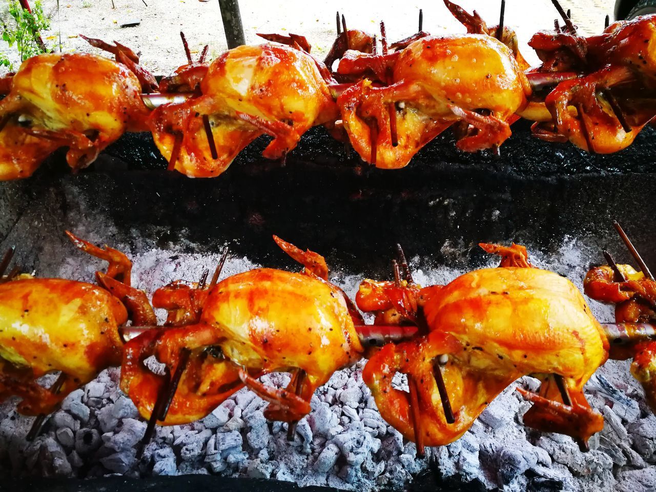 CLOSE-UP OF MEAT ON BARBECUE