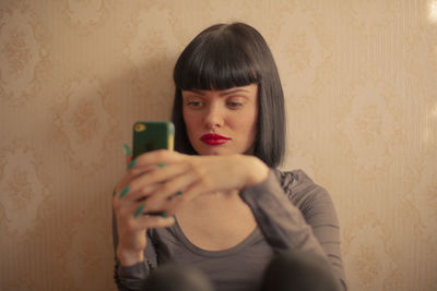 Young woman using mobile phone