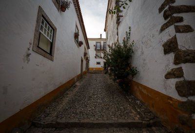 Street amidst buildings against sky